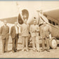GROUP NEXT TO LOCKHEED AIRPLANE VINTAGE REAL PHOTO POSTCARD RPPC