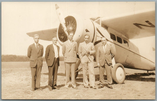 GROUP NEXT TO LOCKHEED AIRPLANE VINTAGE REAL PHOTO POSTCARD RPPC