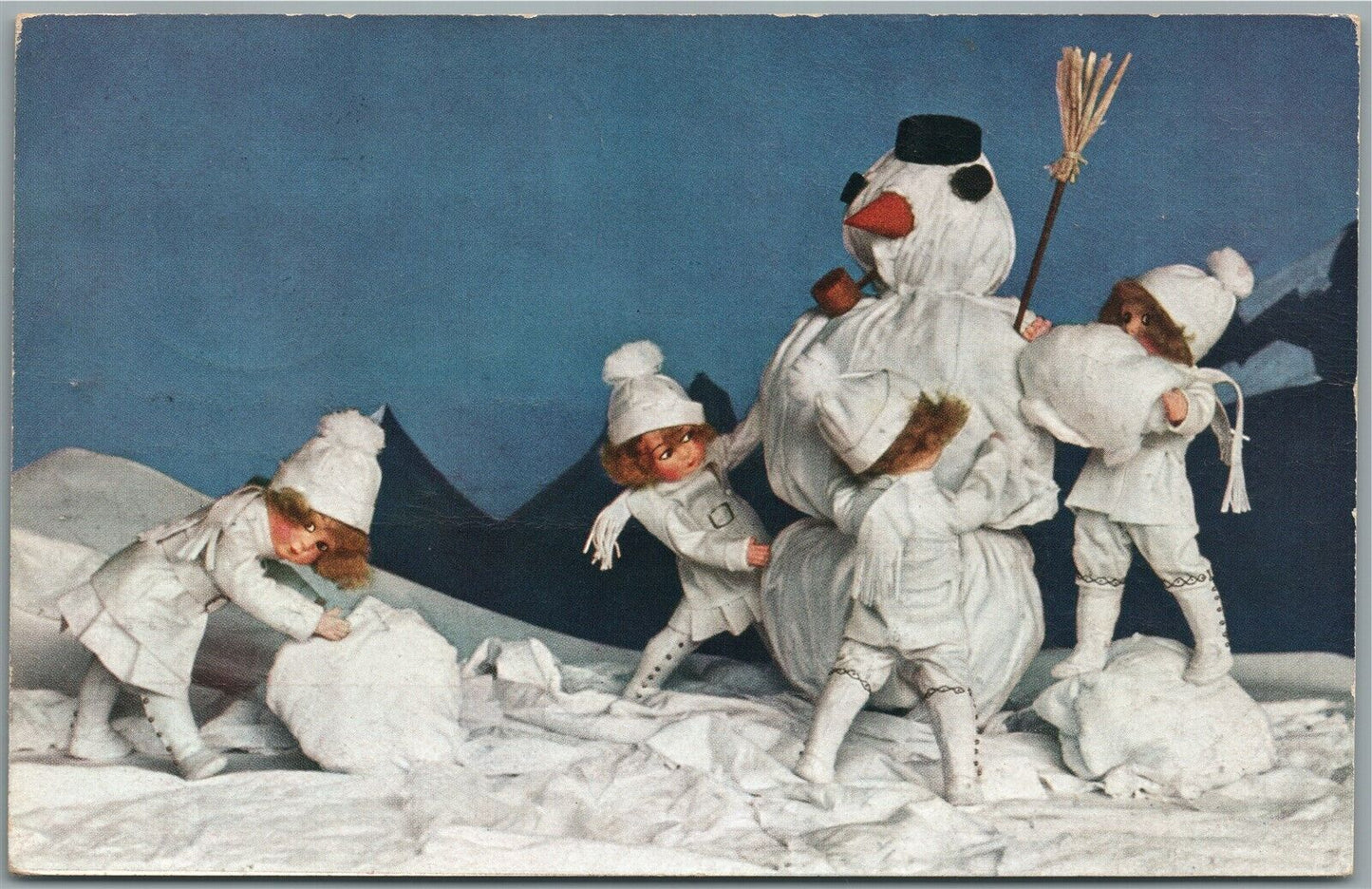 KIDS MAKING SNOWMAN CHRISTMAS ANTIQUE POSTCARD