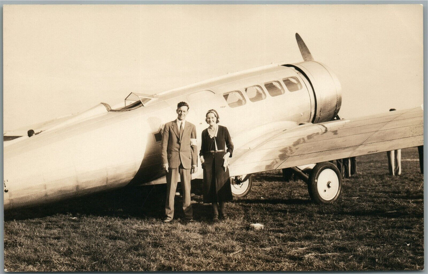 COUPLE NEXT TO AIRPLANE VINTAGE REAL PHOTO POSTCARD RPPC