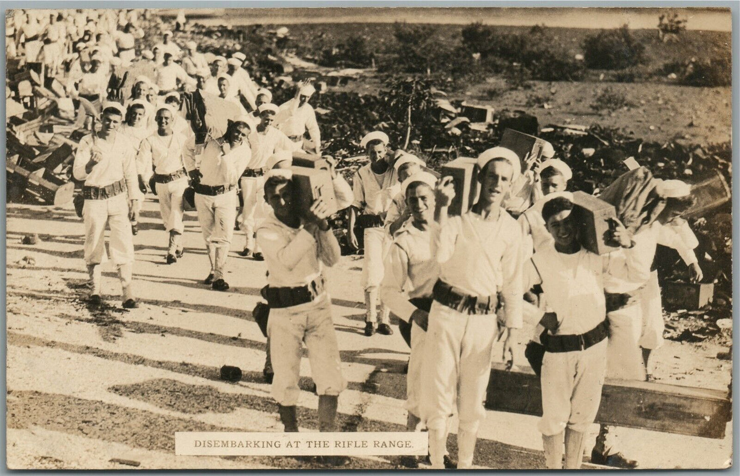 AMERICAN WWI ERA DISEMBARKING AT RIFLE RANGE ANTIQUE REAL PHOTO POSTCARD RPPC
